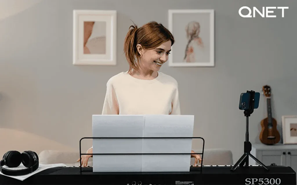 Positive women playing piano