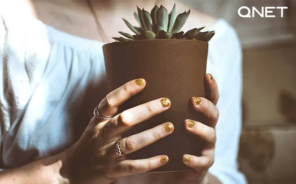 Woman holding flower pot