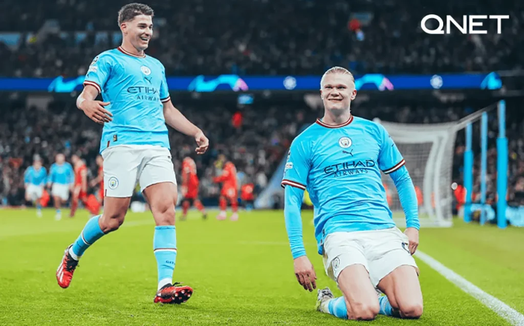 Energetic Erling Haaland and Iikay Gundogan celebrating a goal