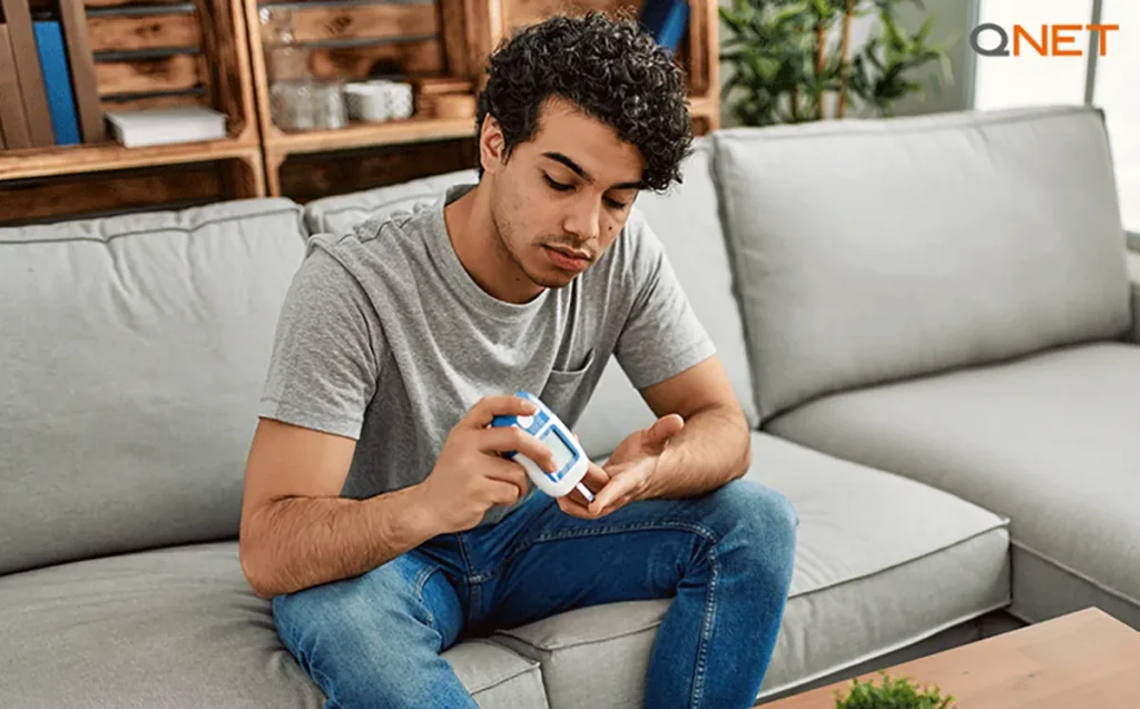 A young man checking diabetes
