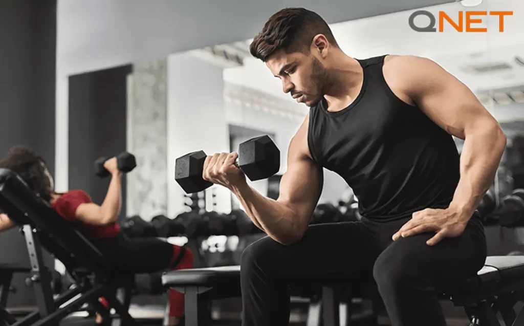 A young man working out at a gym