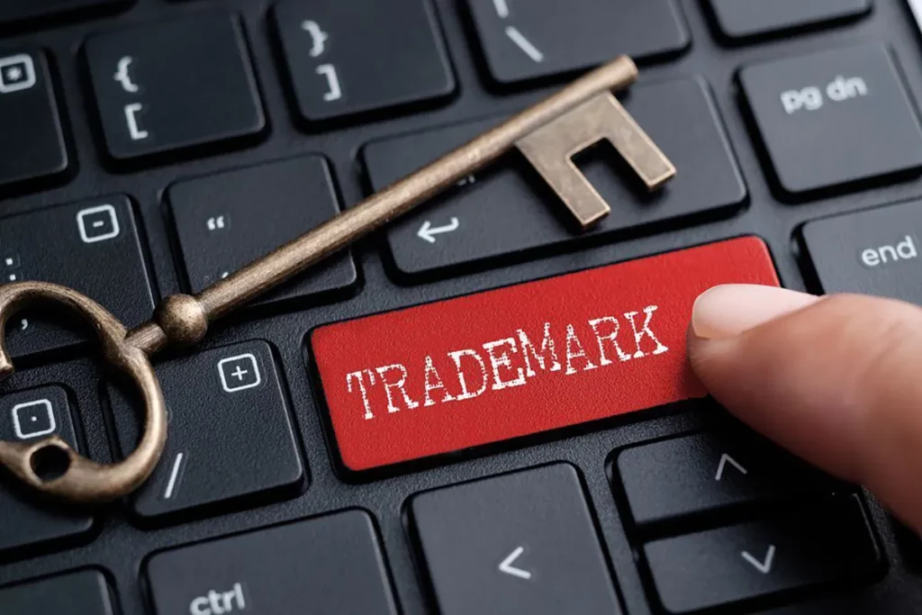 QNET's Social Media Policy: A red Trademark keyboard button with a key signifying right usage of company trademark